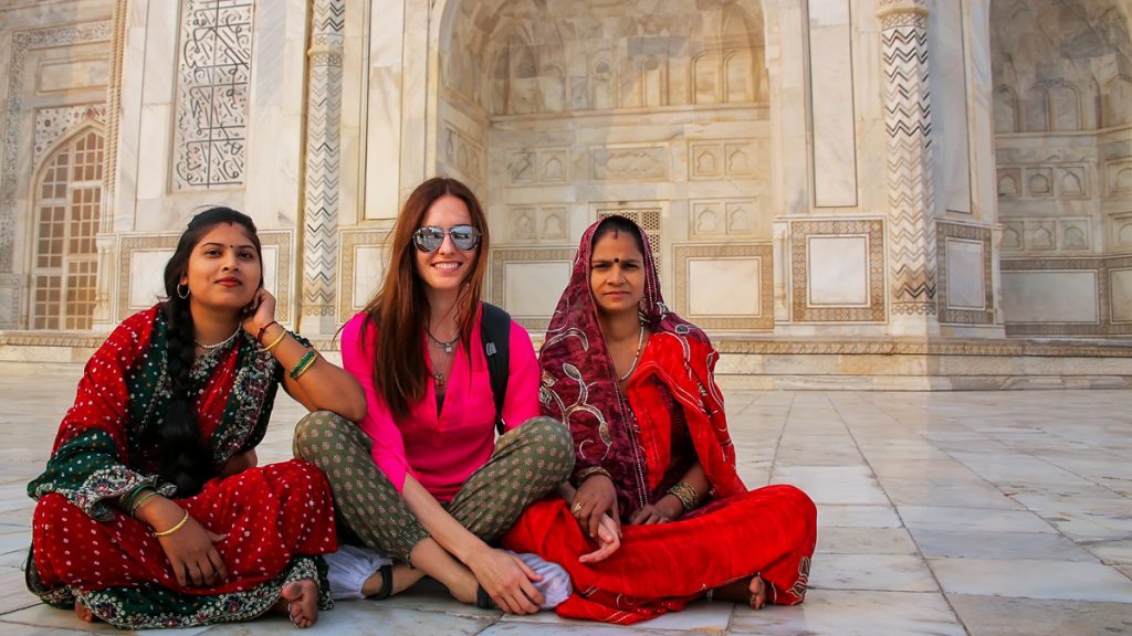 Unidentified women sit outside Taj Mahal in Agra