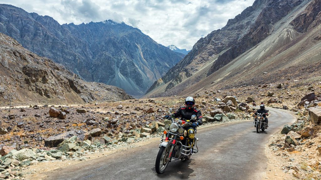 A motorbike enthusiast riding through the hills of Ladakh