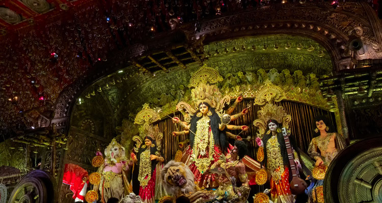 A beautiful picture of a decorated Durga Puja pandal, shot in colored light, at Kolkata, West Bengal, India.